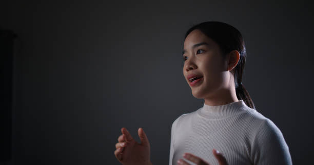 istock Young woman is presenting a business plan on stage. 2059810083