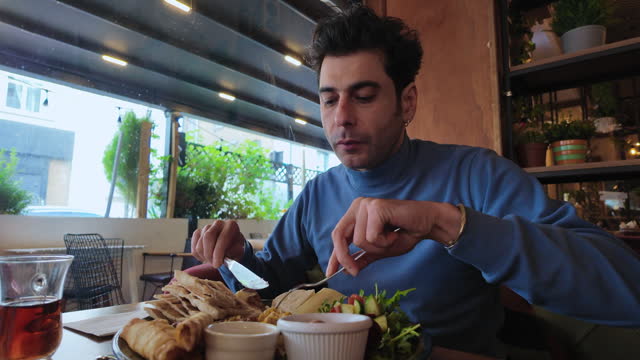 Man Having Breakfast In A Restaurant