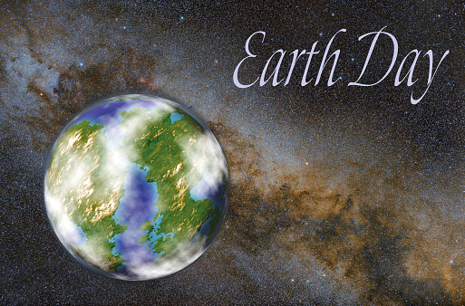 Planet Earth in space on the background of the Milky Way. Space landscape on Earth Day theme. Inscription Earth Day.