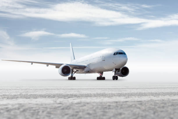 istock White wide body passenger airliner isolated on bright background with sky 2059913325