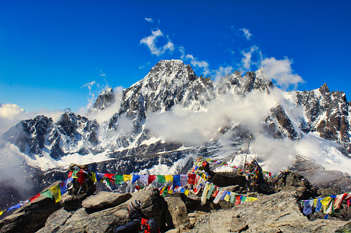 Summit of Gokyo Ri, famous view point for viewing 5 of the 14 8000ers in the world along with Prayer flags at a height of 5350 meters in Nepal