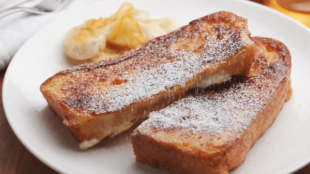 Caramel French Toast with Banana and Orange Marmalade, Sprinkled with Powdered Sugar