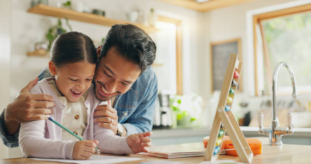 istock Homework, father and girl with education, teaching and conversation with support, excited and knowledge. Female child writing, student and proud dad with a kid, kitchen and learning with development 2059976235