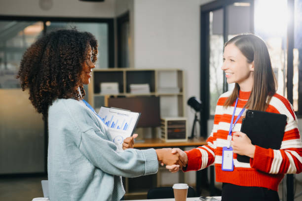 istock Two confident business man shaking hands during a meeting in the office, success, dealing, greeting and partner 2059983861