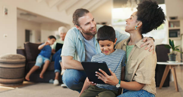 istock Tablet, home and happy family parents, kid or people working on e learning, knowledge or helping son with studying. Elearning, remote online education and young child, mother and father bond together 2059987590