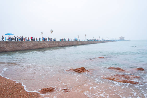 Qingdao City, Shandong Province, China - October 4th 2019: Photo of Citizens taking walks by the seaside