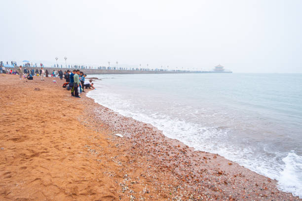 Qingdao City, Shandong Province, China - October 4th 2019: Photo of Citizens taking walks by the seaside