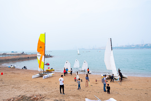 Qingdao City, Shandong Province, China - October 4th 2019: Photo of Citizens taking walks by the seaside