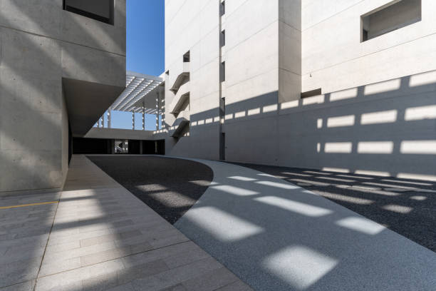 istock Sunshine leaves light and shadow on cement walls and structures in modern architecture 2060000489