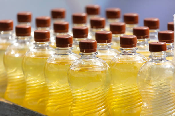 istock Bottles of sunflower oil on a light background. Selective focus 2060004206