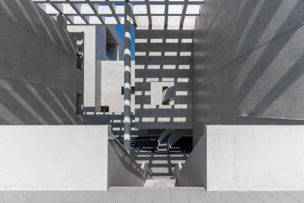 istock Sunshine leaves light and shadow on cement walls and structures in modern architecture 2060007945