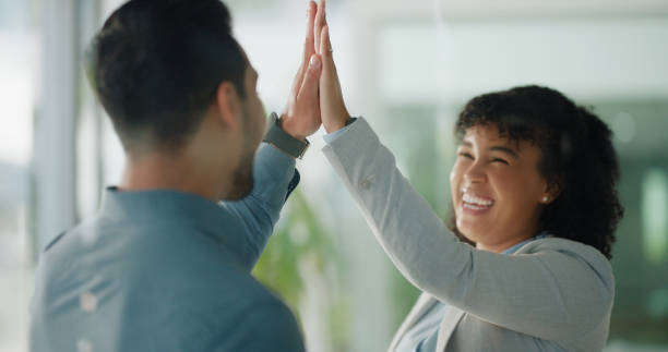 istock Business, success and people high five in office in support, celebration or congratulations. Corporate, hands or friends excited for achievement, job promotion or morning greeting for work motivation 2060015391