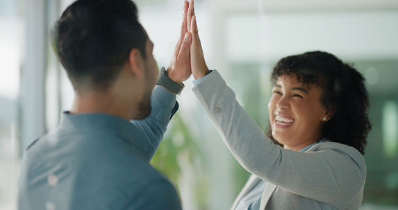 Business, success and people high five in office in support, celebration or congratulations. Corporate, hands or friends excited for achievement, job promotion or morning greeting for work motivation