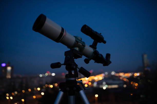 istock Astronomical telescope for observing stars, planets, Moon, celestial objects. Observing sky from urban light polluted area. 2060021243