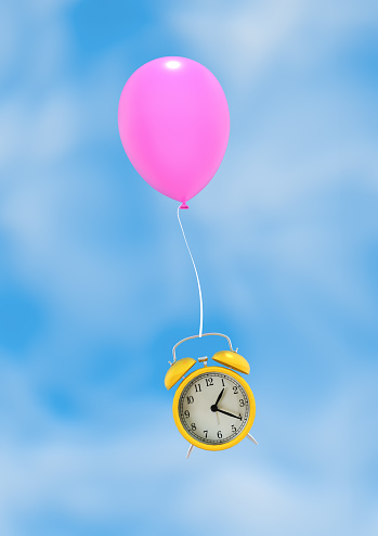 Yellow alarm clock flying with a pink air balloon against blue sky background. Time flies concept. 3D render.