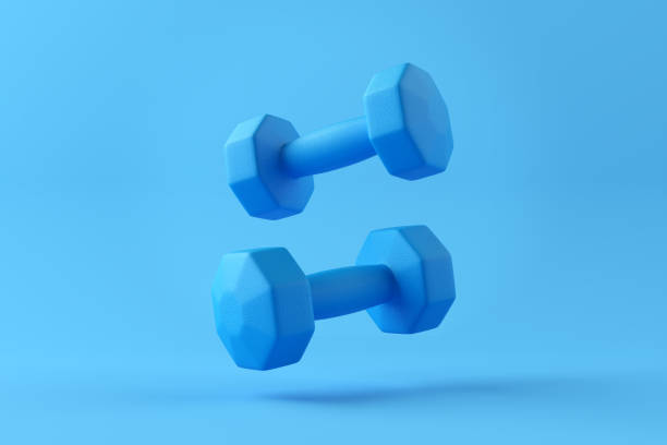 istock Blue dumbbells levitating on blue background with copy space. 2060025011