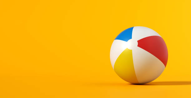 istock Inflatable beach ball on yellow summer background. 2060031103