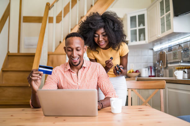 istock Couple using credit card at home and doing a online reservation 2060042032