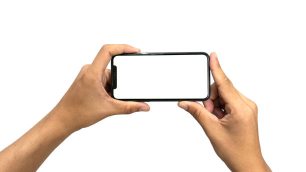 istock Close up hand holding modern smart phone mockup. New modern black frameless smartphone mockup with blank white screen. Isolated on white background high quality studio shot Modern smart 2060047448
