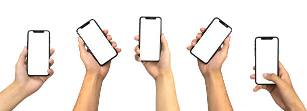 istock Close up hand holding modern smart phone mockup. New modern black frameless smartphone mockup with blank white screen. Isolated on white background high quality studio shot Modern smart 2060047825