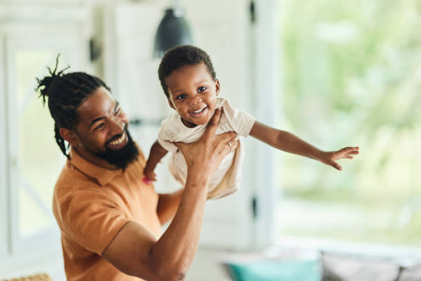 istock Happy black single father and son having fun at home. 2060051796