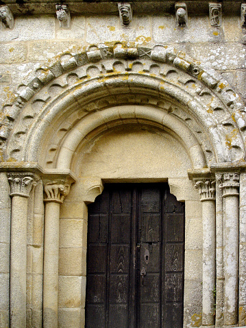 Santa María rural romanesque stone church, side doorway, Melide, A Coruña province, Galicia, Spain. Camino de Santiago, camino francés.