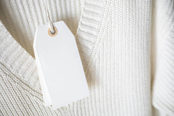 istock White knitted clothing with blank label. 2060072303