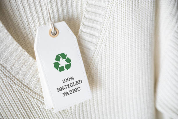 istock White knitted clothing with white label Recycling. 2060075463