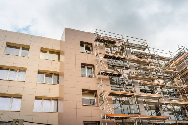 istock Tall building under construction with scaffolds.Scaffolding on multi storey building facade during renovation. 2060092908