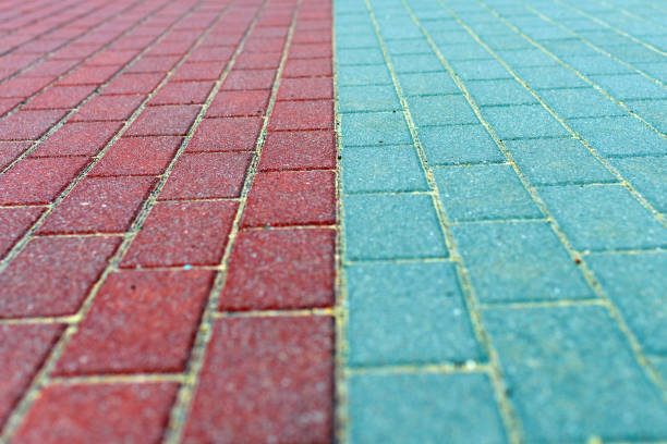 The warm-toned brick pavement features a textured surface, arranged in a neat pattern. This inviting walkway suggests a cozy outdoor space, perfect for gatherings or leisurely strolls.