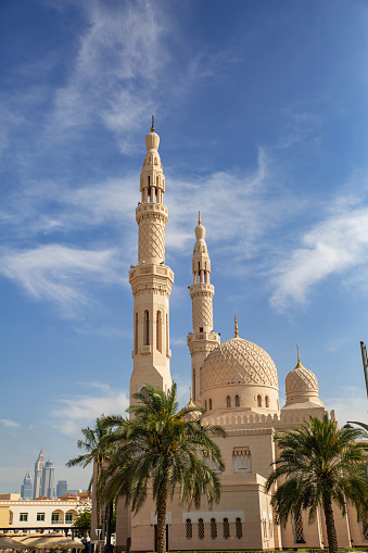 Close-up shot of minaret and dome of a typical mosque in arabian country