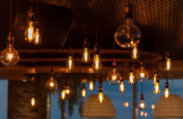 istock Decorative antique edison style filament light bulbs hanging from ceiling 2060105270