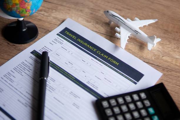 istock Selective focus image of travel insurance claim form on a wooden table. 2060108499