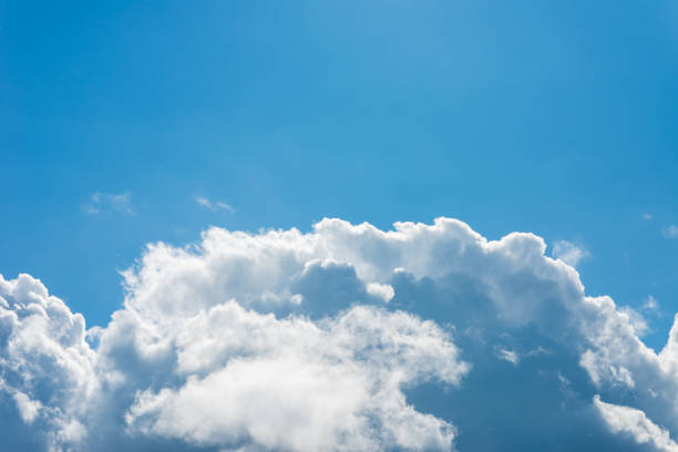 istock Big Clouds.bright beautiful blue sky with clouds.a big and fluffy cumulonimbus,cumulus cloud in the blue bright sky. 2060111273