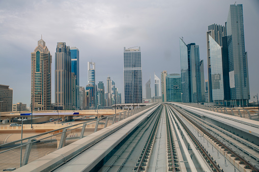 Financial center with skyscrapers and subway rails.