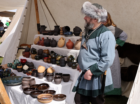 Cracow, Poland - April 11, 2023: Handmade imitations of medieval ceramic vessels in knight camp at the festival of historical reconstruction