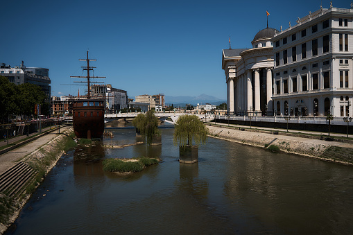 Skopje Macedonia, July 21, 2022: a  rusty ship on the summer river in skopje