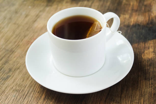 istock a cup of hot tea on a wooden table 2060130290