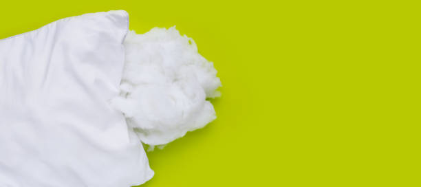 istock White pillow with polyester stable fiber on green background. 2060133661