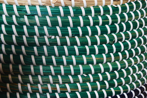 Green and white abstract background. Weave texture pattern. texture of rattan mats, baskets or furniture.