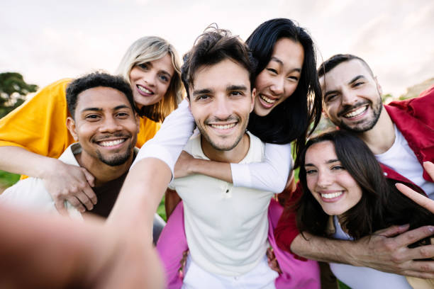 istock Joyful group of young student friends having fun together outside 2060145800