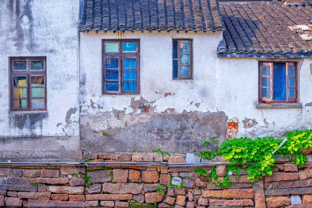Wall of castle ruins, stone wall texture . \nMedieval castle ruins, old European architecture, ruined window of an old castle made of stone