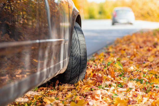 istock Car on asphalt road on autumn day at forest or park.Selective focus,copy space. 2060152168