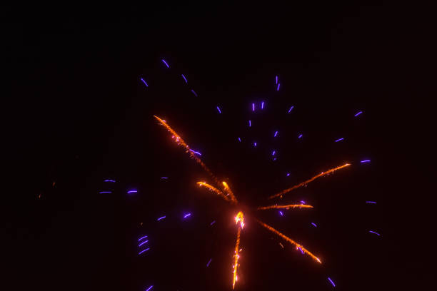 Abstract blurred beautiful firework for background.colorful firework for celebration.Festive fireworks colorful display dark background.Beautiful light for celebration.Happy new year 2022 wallpaper.
