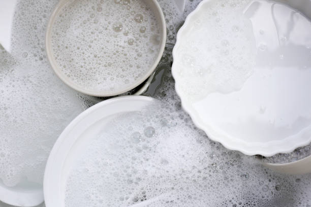 istock Dish washing, Dirty dishes soaking in kitchen sink. 2060162697