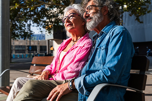 Beautiful happy senior couple bonding outdoors - Cheerful old people romantic dating in the city, concepts about elderly and lifestyle