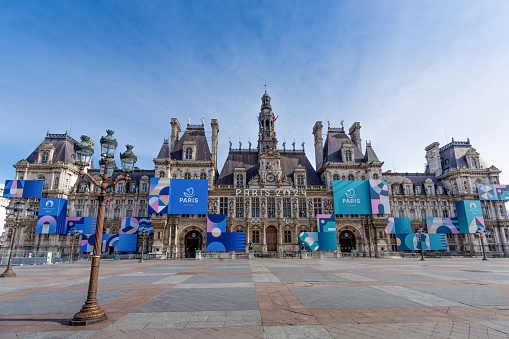 Paris, France - March 4, 2024: Exterior view of the town hall of Paris, France, decorated for the Olympic and Paralympic Games. Paris is the host city of the 2024 Summer Olympics