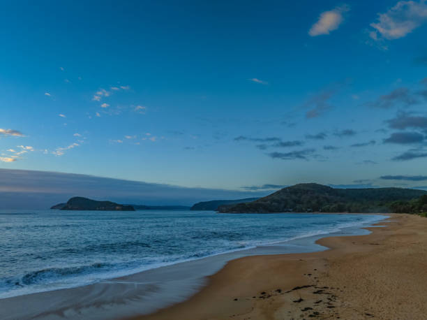 istock Sunrise, clouds and surf at the seaside 2060175164