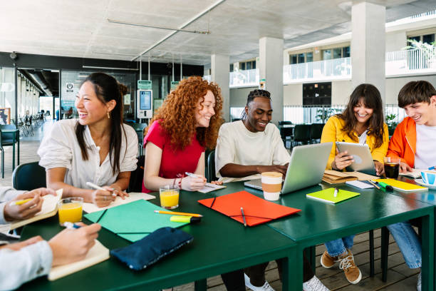 istock Diverse student group of college people studying together at college campus 2060178434