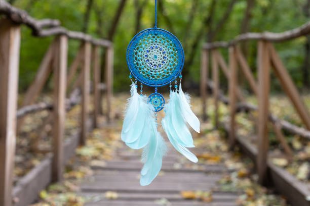 istock Handmade dream catcher with feathers threads and beads rope hanging 2060180104